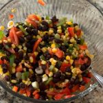 Fresh black bean corn salad with colorful ingredients