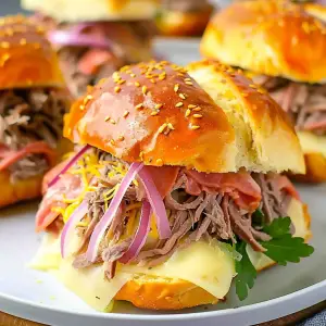 Delicious party roast beef sandwiches fresh out of the oven.