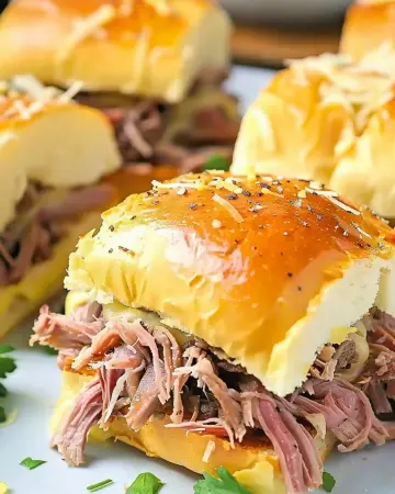 Delicious party roast beef sandwiches fresh out of the oven.